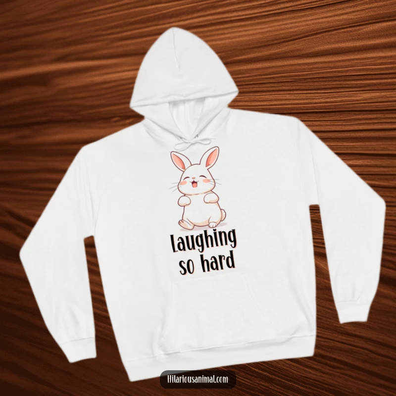 Funny rabbit hoodie showing a bunny with its belly exposed, shaking with silent laughter, a cozy and humorous piece.