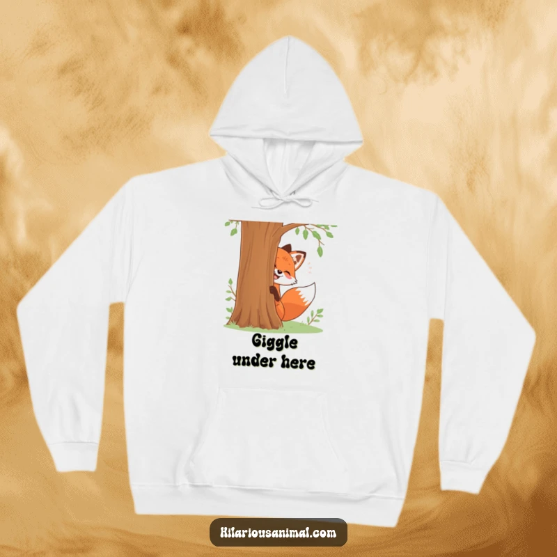Funny hoodie showing a red fox giggling mischievously while peeking from behind a tree, a great funny gift.